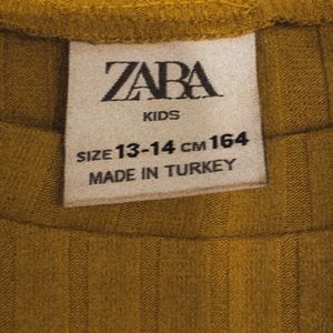 yellow body suit (with 'give me five' imprint)